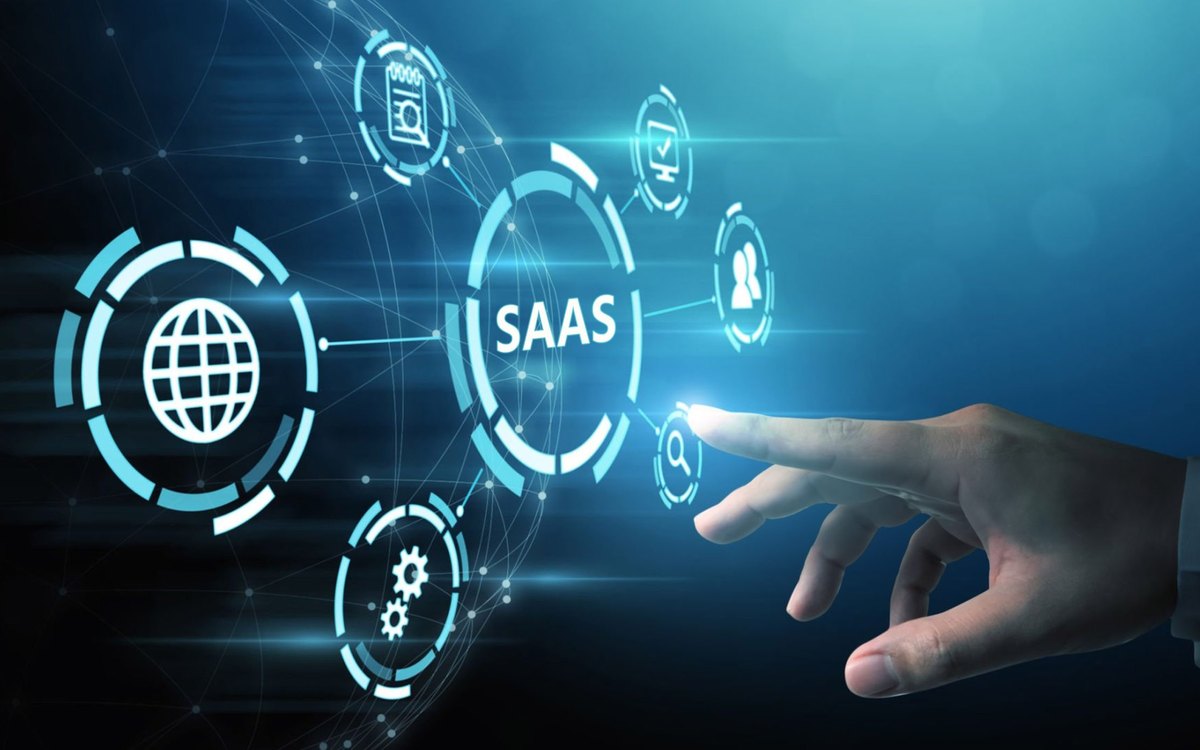 A hand reaching towards a connected SaaS platform diagram